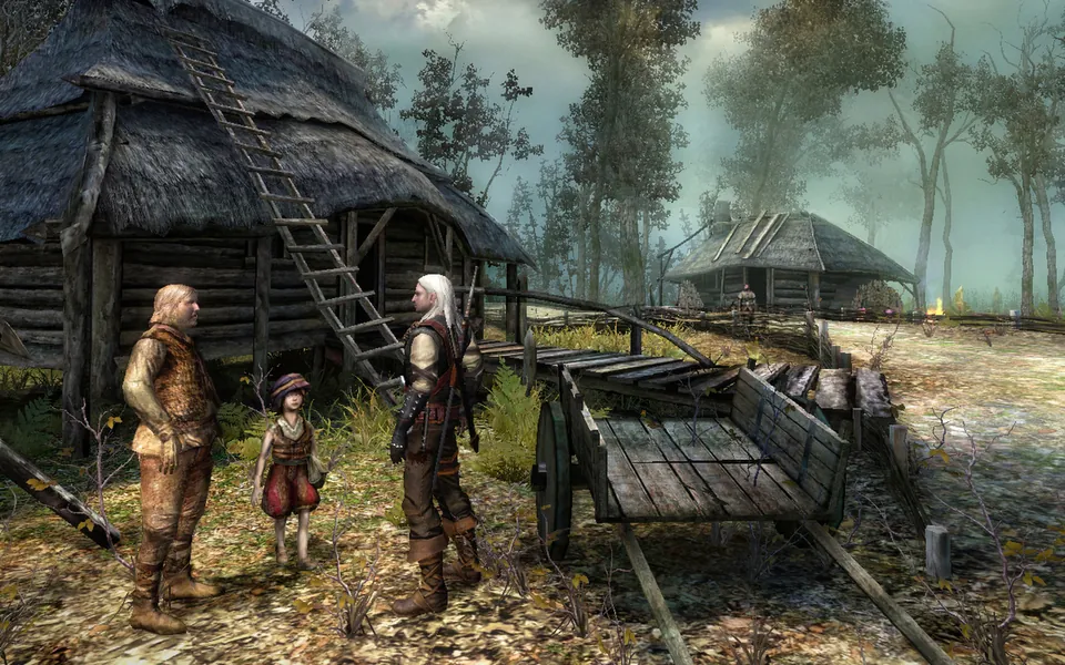 Geralt talks with villagers next to a wooden hut and a cart in the first Witcher game