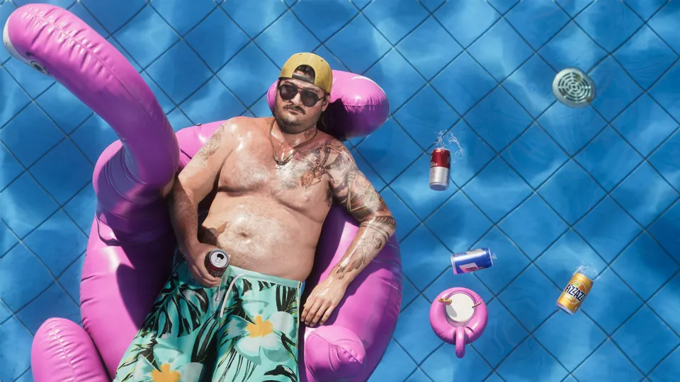 Cal Hampton floats on a pink flamingo pool float with drink cans in Grand Theft Auto VI