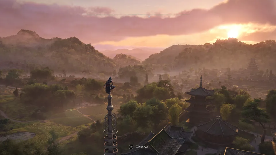 An assassin perched on top of a pagoda spire at sunset over the hills of feudal Japan in Assassin's Creed Shadows