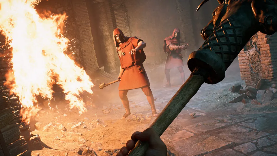 Indy holds up a torch as robed Mithras cultists charge through a burning crypt