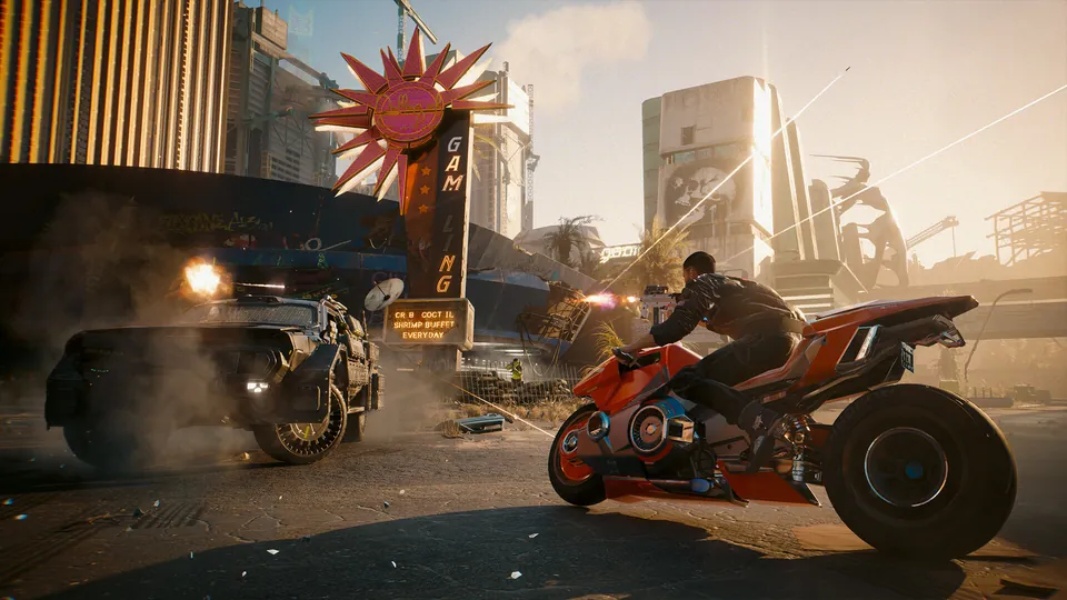 V on a red motorcycle shoots back at a pursuing armored car in a sunlit Dogtown chase in Phantom Liberty
