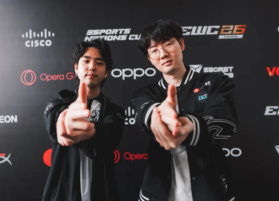 Two Bilibili Gaming players pose with finger guns at the media wall during MSI 2026 in Daejeon