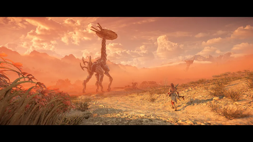 A towering long-necked Tallneck machine walks across an orange desert at sunset while a hunter watches in Horizon Forbidden West
