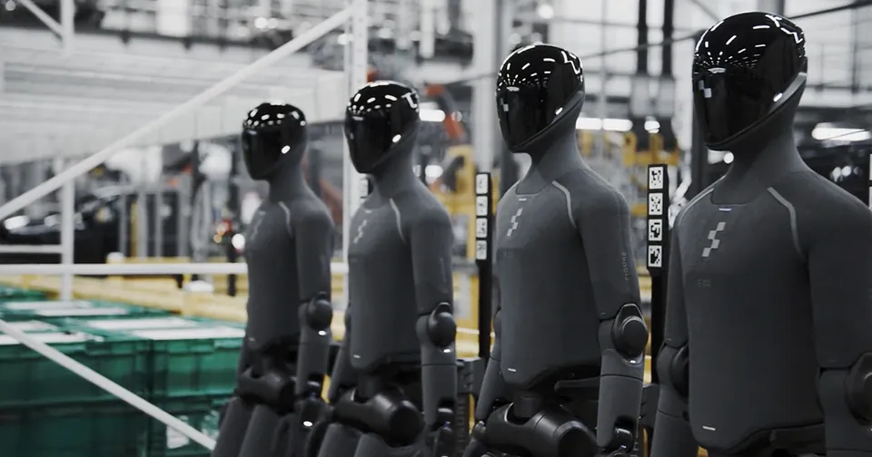 Figure 03 robots in dark covers standing in a row in a factory