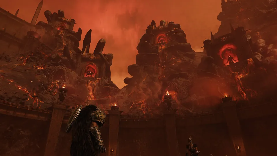 A lone armored figure stands in a vast arena of molten rock and burning towers under a red sky in Doom: The Dark Ages Revelations