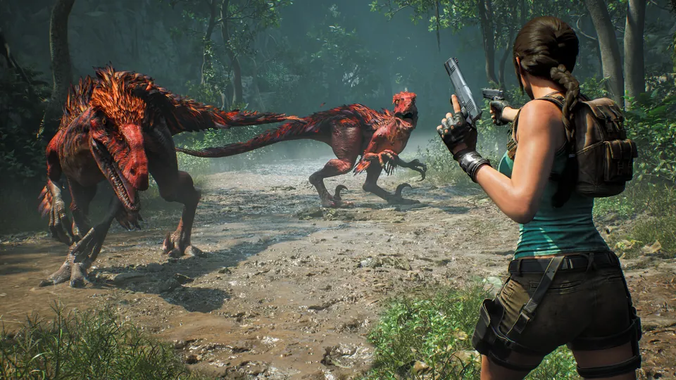 Lara Croft aims a pistol at two red raptors on a muddy jungle path in Tomb Raider: Legacy of Atlantis