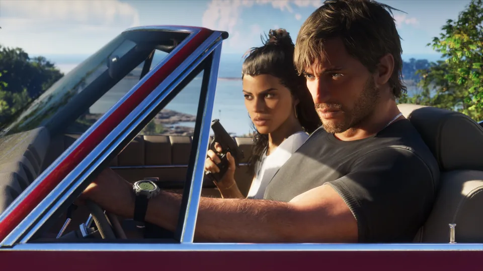 Jason drives an open-top car while Lucia sits beside him holding a pistol