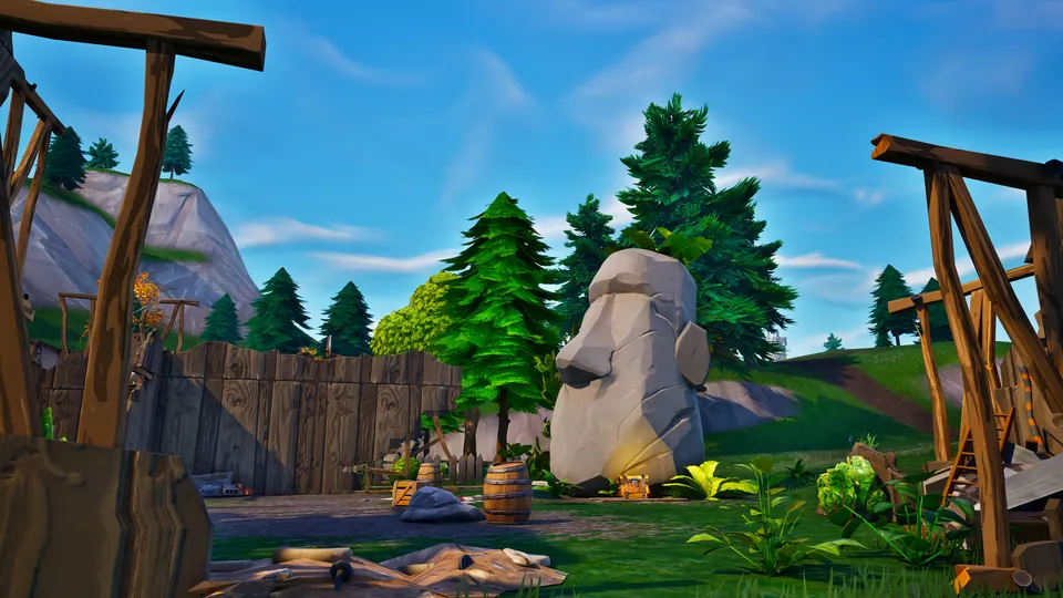 A stone head statue in a Fortnite forest camp
