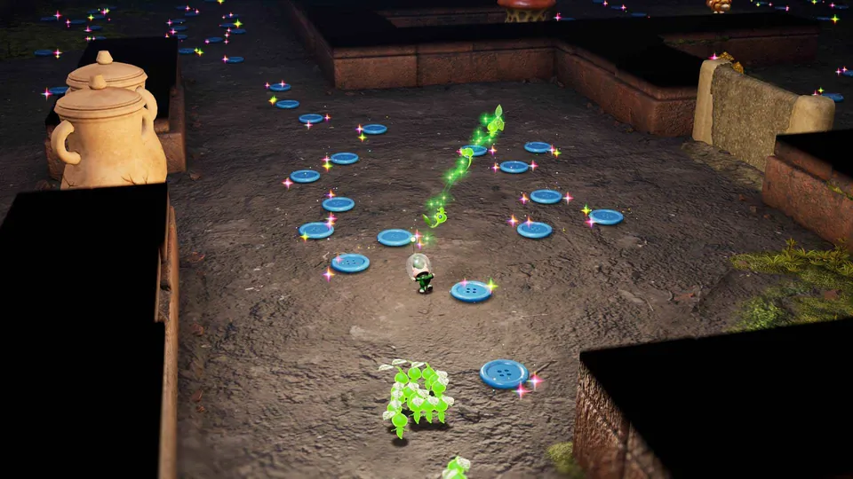 Glowing Pikmin trail across a dark room scattered with blue buttons and clay pots