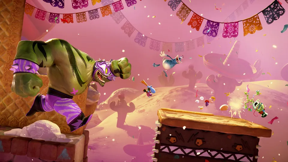 A giant luchador wrestler leaps at the heroes in a pink fiesta level strung with paper banners in Rayman Legends Retold