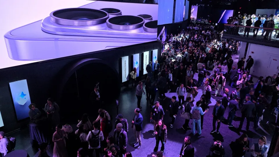 Visitors walk through the Galaxy Unpacked 2026 venue under a giant phone camera model