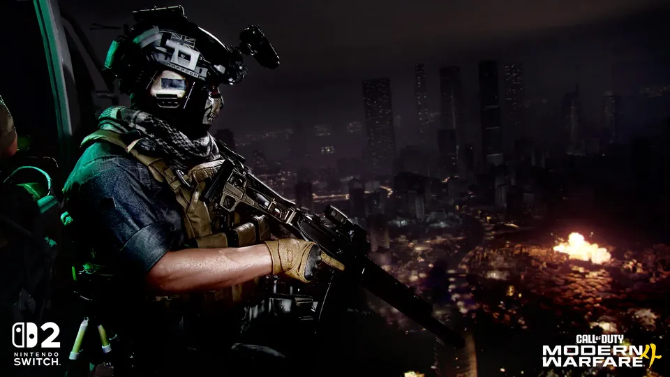 A soldier with a rifle and night-vision goggles looks over a burning city at night in Call of Duty: Modern Warfare 4