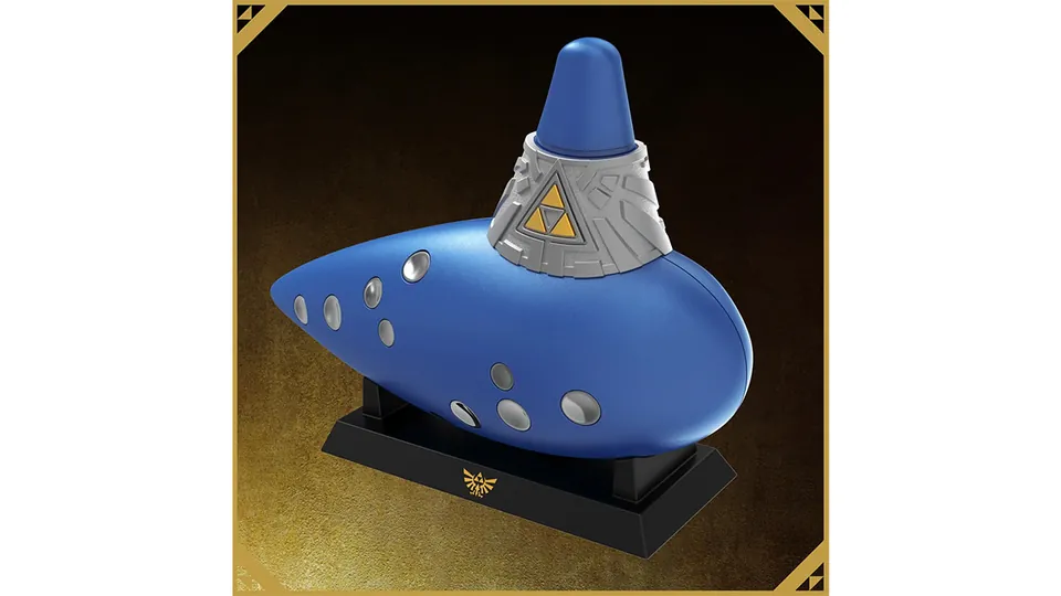 The Electric Ocarina of Time resting on a black stand with a gold Hylian crest.