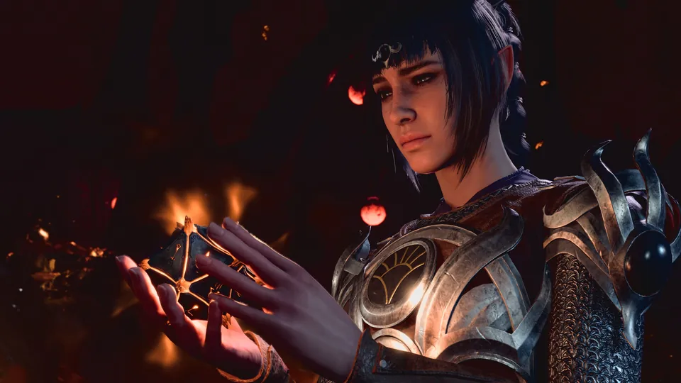 A dark-haired cleric in ornate armor studies a glowing artifact held in one hand