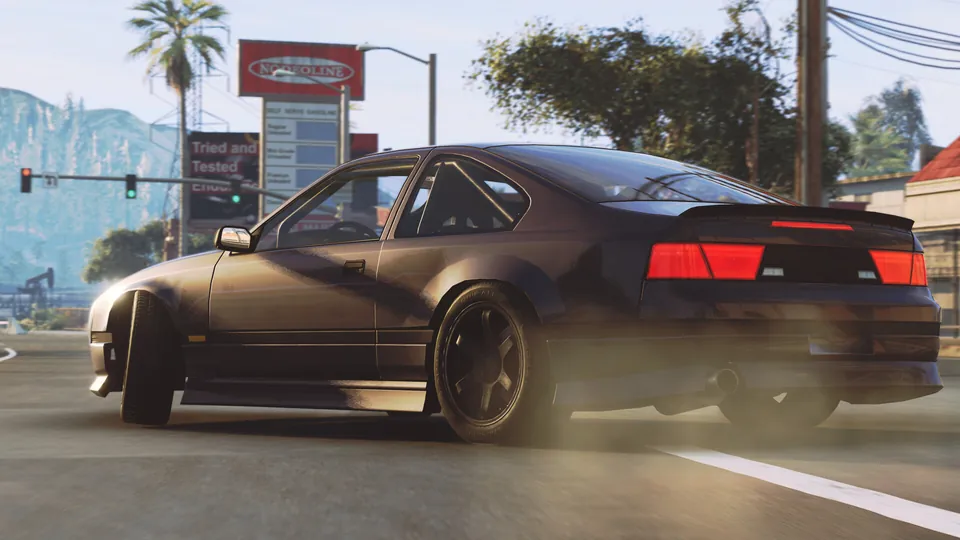 BeamNG.drive screenshot: a dark sports coupe drifts past palm trees on a sunny street