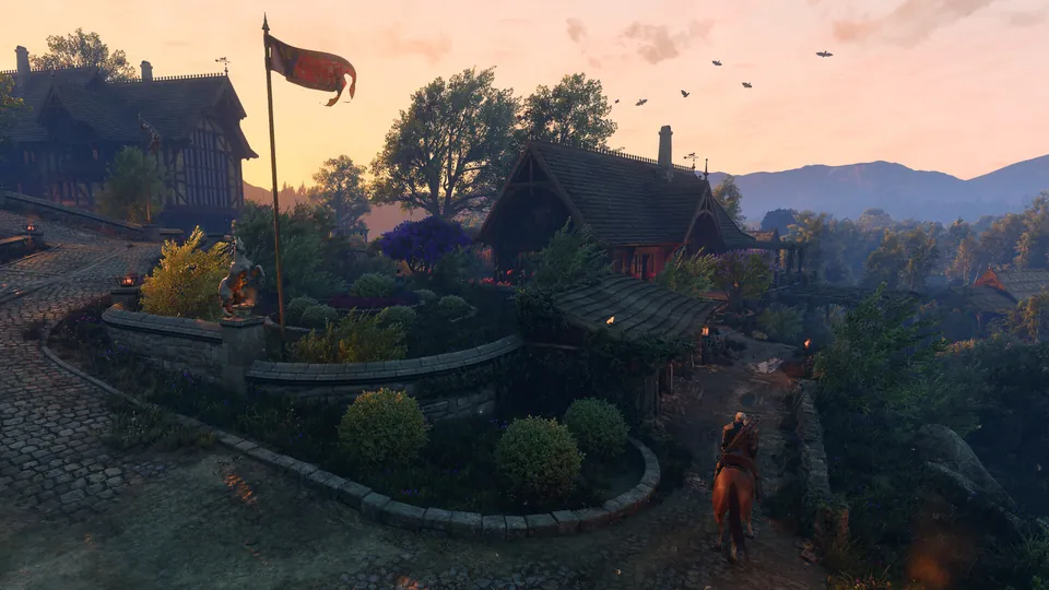 A village in Letten at sunset, with gardens, a red banner and Geralt on horseback, in The Witcher 3: Songs of the Past
