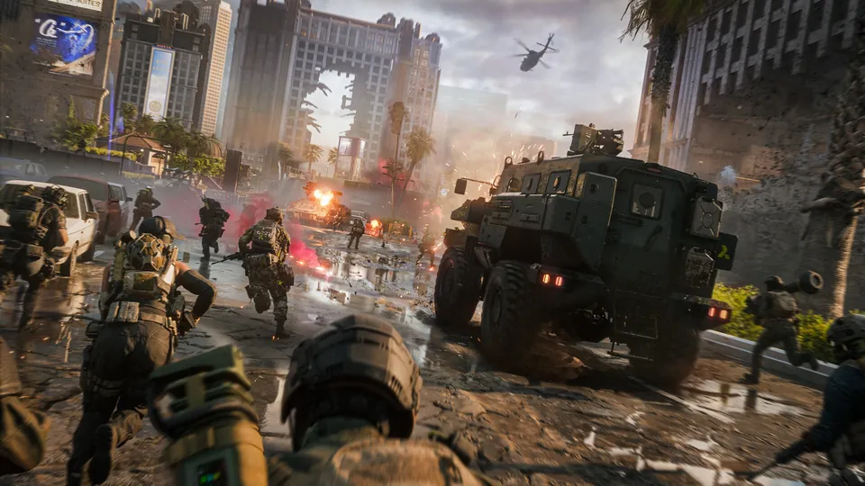 Soldiers run beside an armored truck through a smoky Las Vegas street lined with hotel towers in Battlefield 6