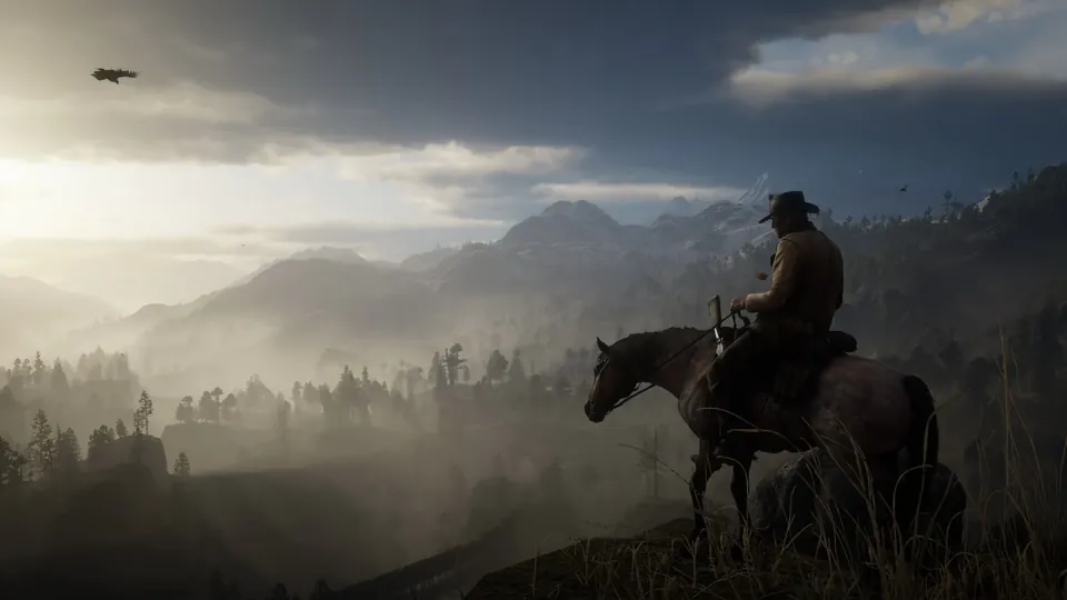 Arthur Morgan on horseback on a ridge above misty forested mountains in Red Dead Redemption 2