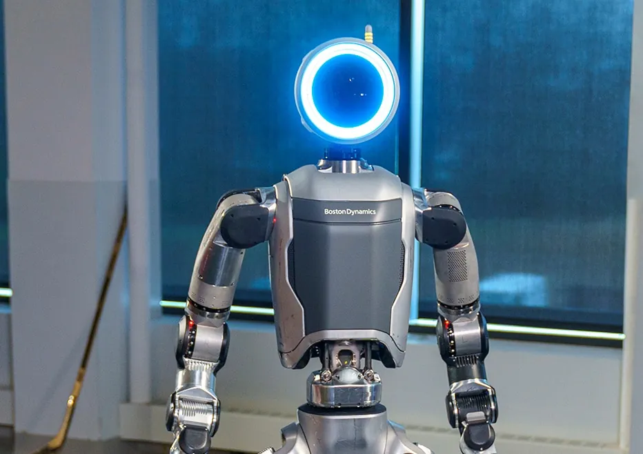 Atlas faces the camera with a blue ring light on its head