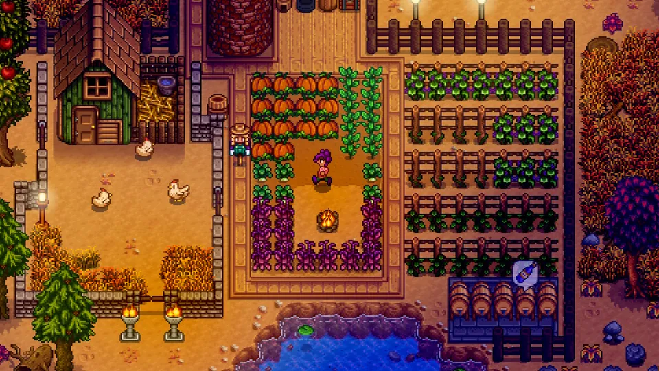 An autumn farm with rows of pumpkins and crops, chickens, barrels and a small barn in Stardew Valley
