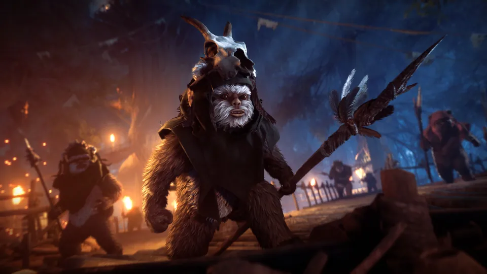 Armed Ewoks gather by torchlight in a forest village at night in Star Wars Battlefront II