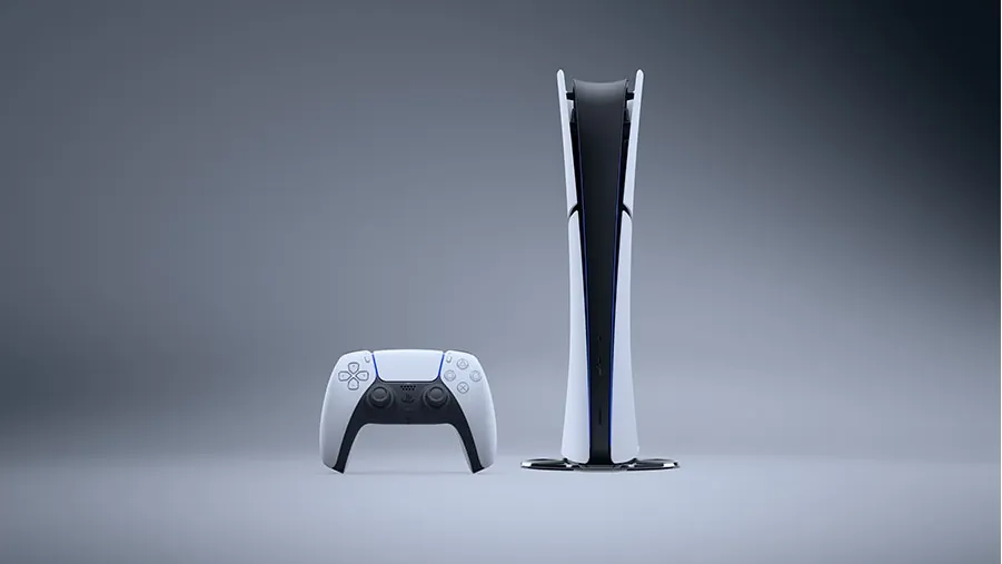 The PS5 Digital Edition standing on a grey floor with a DualSense controller in front of it