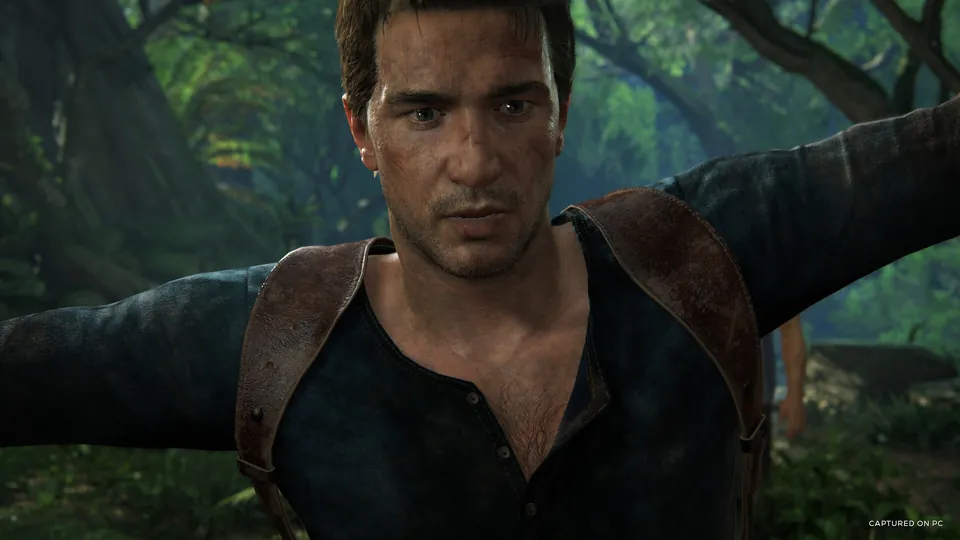 Nathan Drake with arms outstretched in a sunlit jungle in Uncharted: Legacy of Thieves Collection