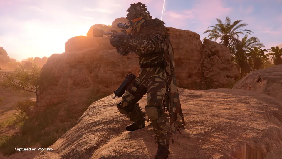 A Helldiver with a scoped rifle on desert rocks at sunset