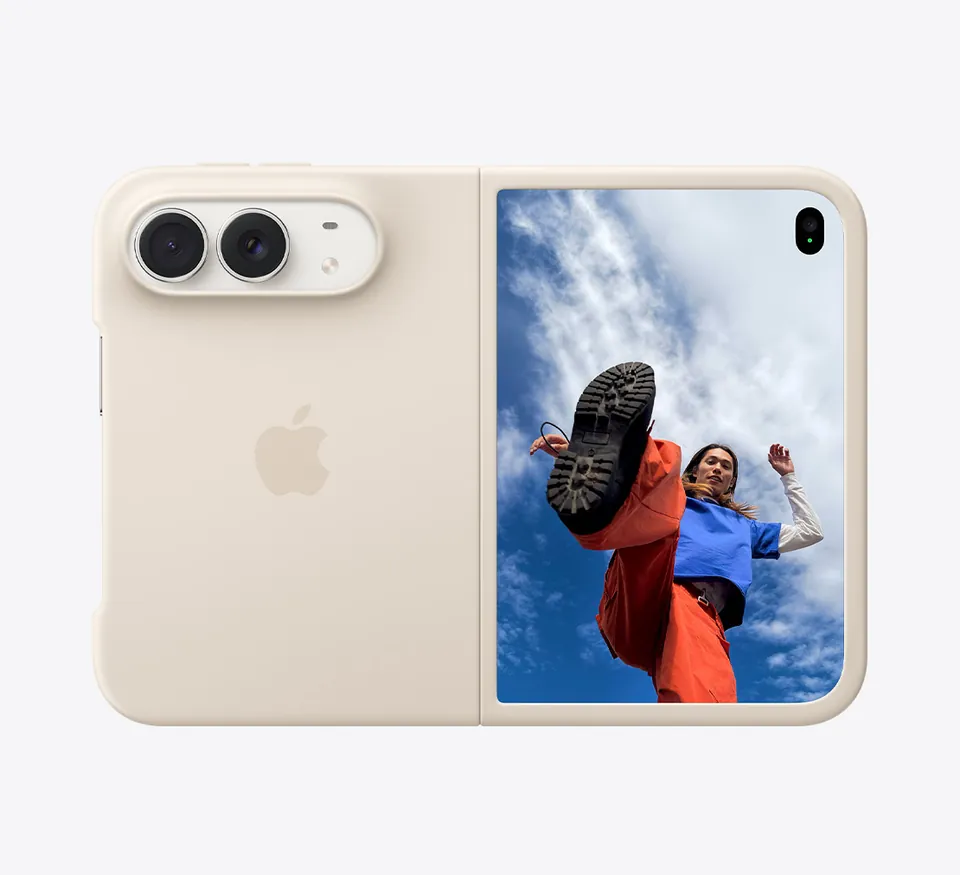 iPhone Duo in a light beige Apple case, open to a photo of a person jumping against a blue sky