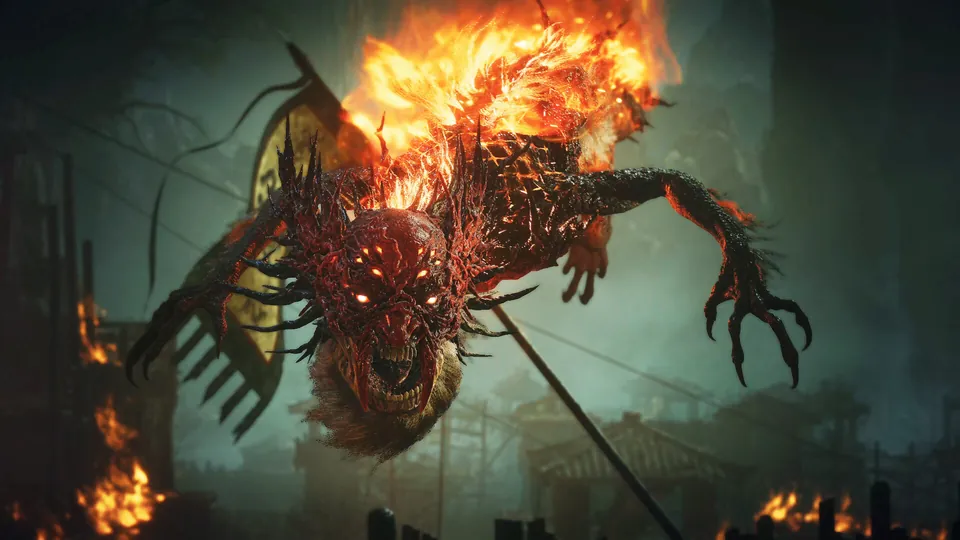 A flaming demon with clawed arms leaps through a burning village in Wo Long 2