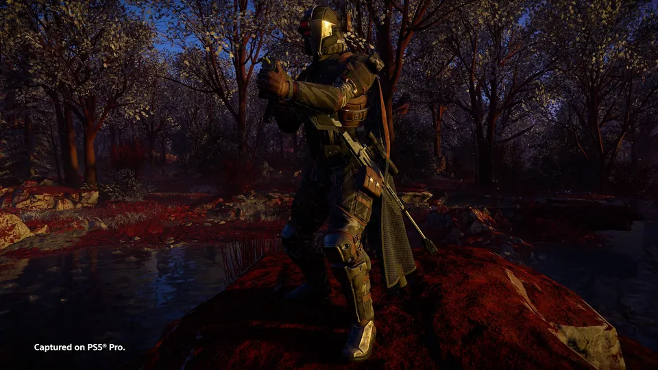 A Helldiver holding a long rifle in a forest at dusk