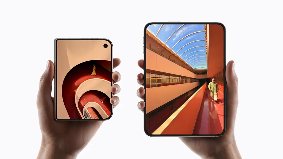 Two hands hold an iPhone Duo closed and another open, with no camera hole visible on the inner screen