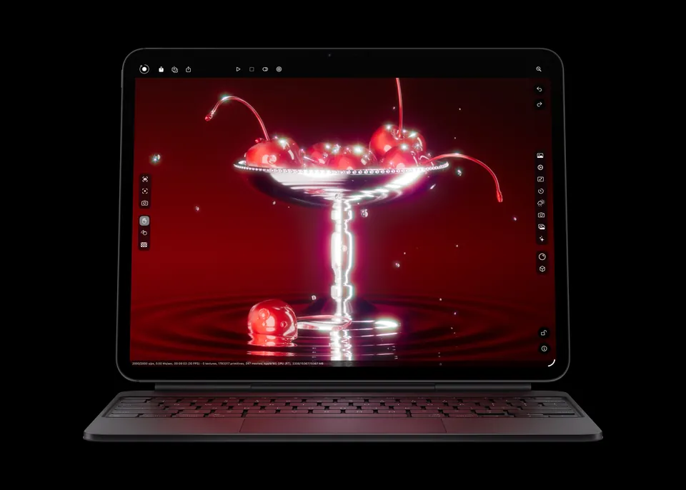 The iPad Pro with M5 on a Magic Keyboard showing a rendered glass of cherries on a red background