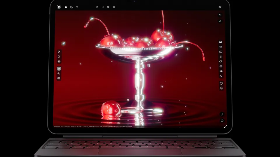 The iPad Pro with M5 on a Magic Keyboard showing a rendered glass of cherries on a red background