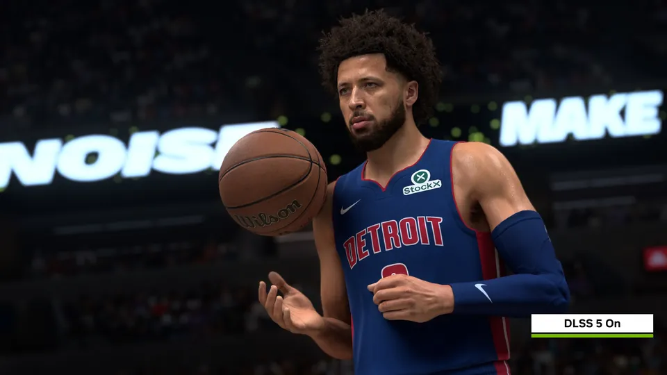 A Detroit Pistons player holding a basketball in NBA 2K27 with DLSS 5 turned on, lit by arena lights