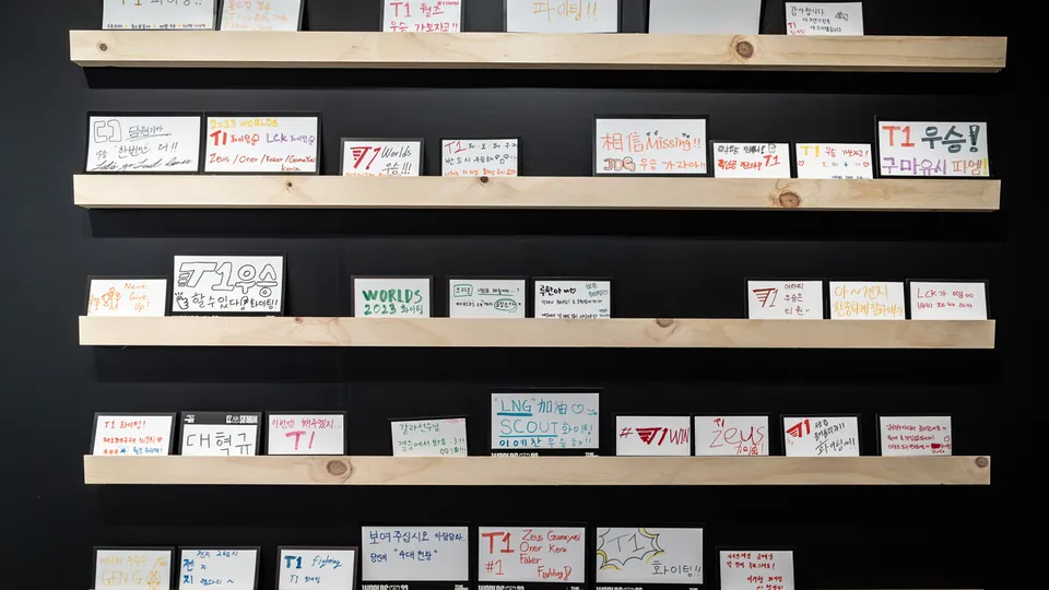 Shelves of handwritten fan signs cheering for T1 and other teams at Worlds 2023 in Korea