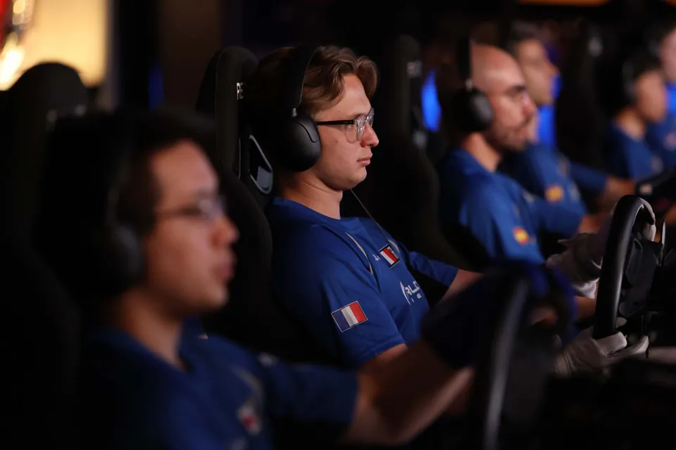 Nations Cup drivers in national team shirts racing on rigs behind closed doors at Polyphony Digital's Tokyo studio