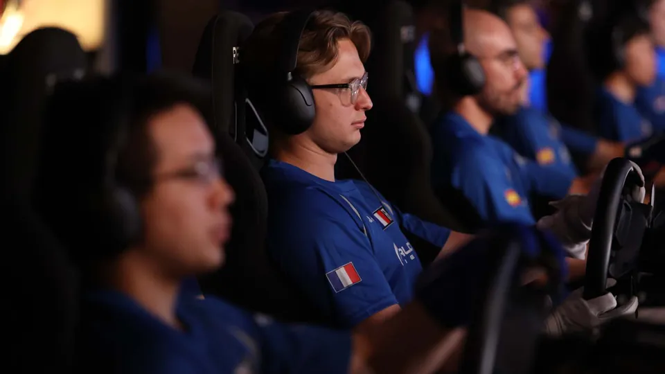 Nations Cup drivers in national team shirts racing on rigs behind closed doors at Polyphony Digital's Tokyo studio