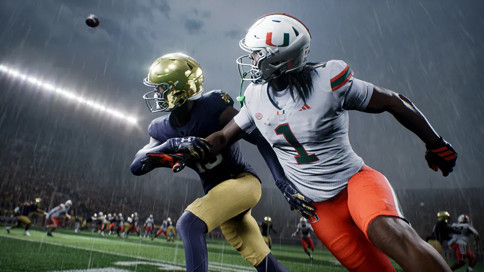 A Miami receiver and a Notre Dame defender chase a pass in the rain in College Football 27