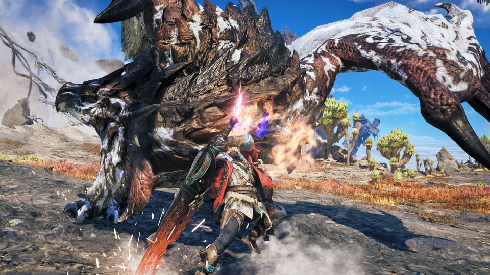 A hunter slashes at a huge rocky, snow-covered monster in Monster Hunter Wilds: Ascendance