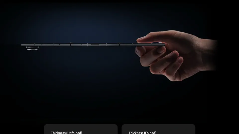 A hand holding the unfolded Galaxy Z TriFold edge-on, with labels for 3.9 mm unfolded and 12.9 mm folded
