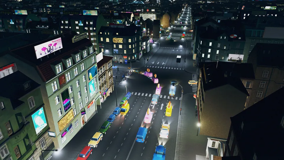 Traffic fills a downtown street at night under lit billboards in Cities: Skylines Expanded Edition