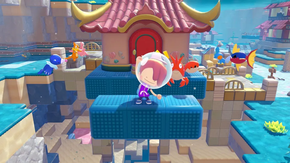 Ditto in a diving helmet stands on floating blue buoyant blocks surrounded by water Pokémon and a pagoda-roofed house under the sea in Pokémon Pokopia