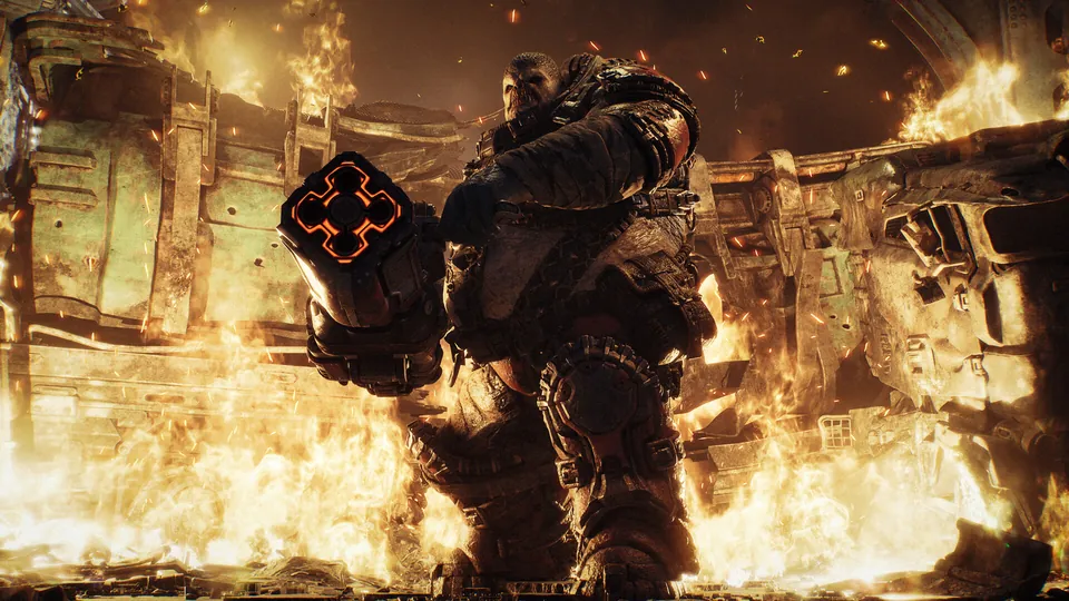 A soldier in heavy armor surrounded by flames in Gears of War: E-Day