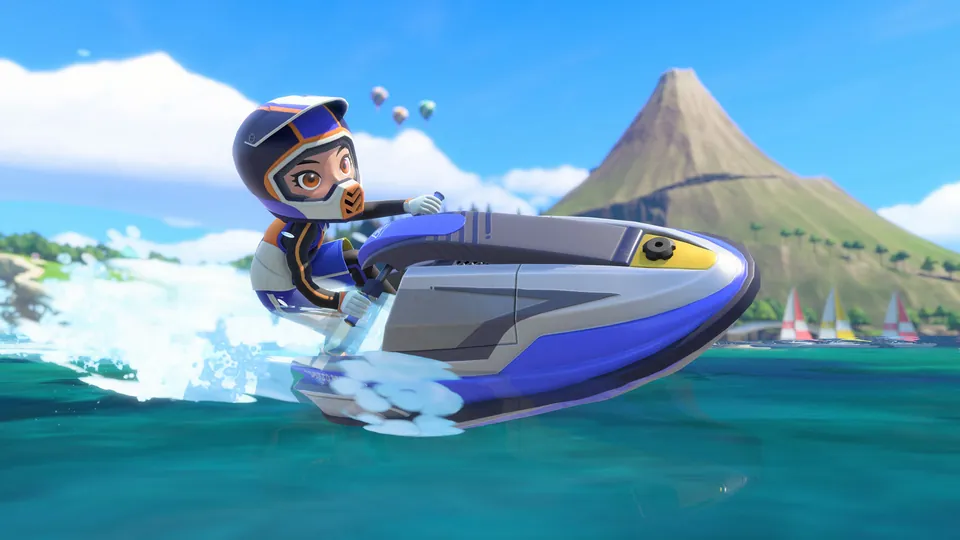 A rider on a jet ski races past a volcano island