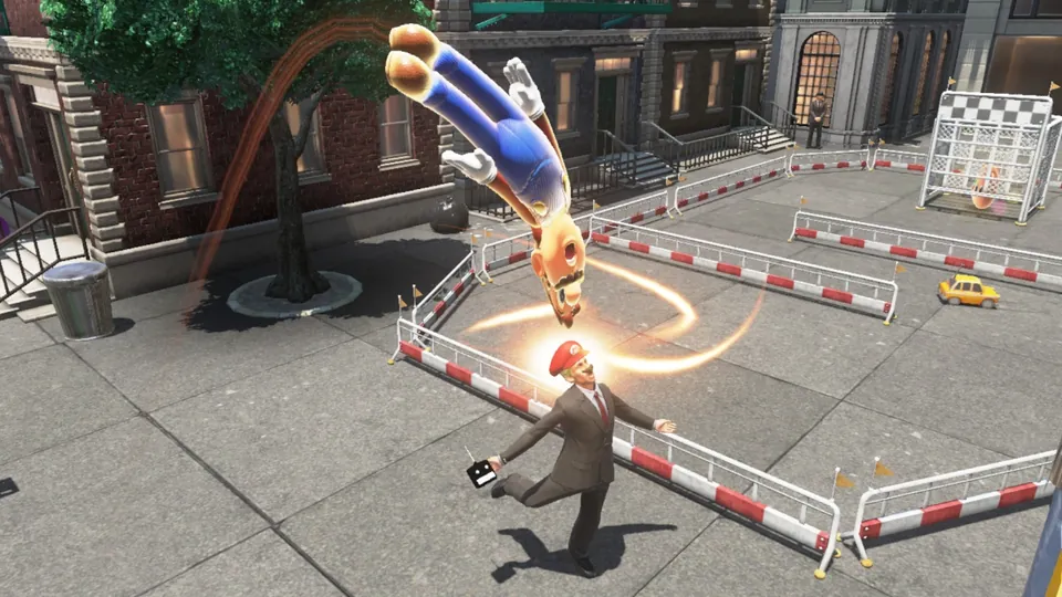 Mario flips through the air above a city plaza while a red cap spins toward a person in a suit in Super Mario Odyssey