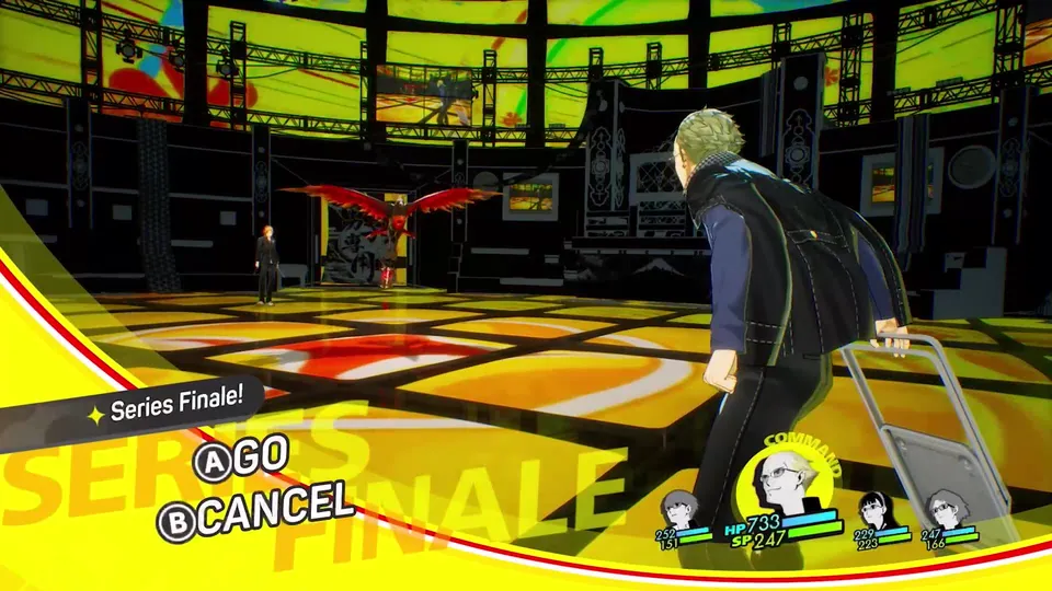 A party member pulls a suitcase across a yellow stage in the TV world, with A Go and B Cancel button prompts