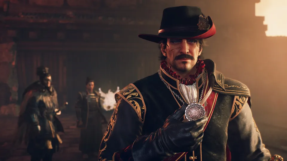 A man in a black hat with a red feather holds up a silver medallion in a dim hall in Nioh 3 Hell Rising.