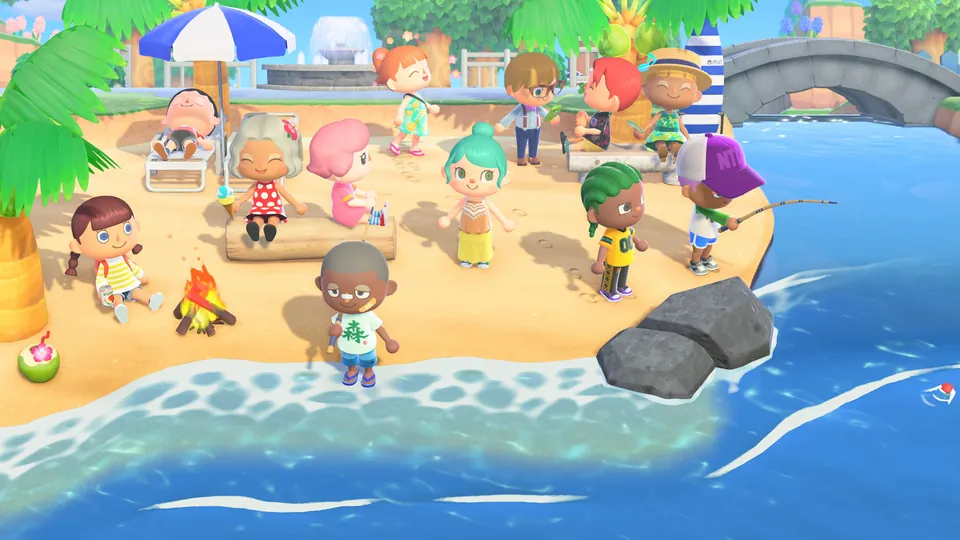 Twelve player characters relax, fish and sit by a campfire on a sunny beach in Animal Crossing: New Horizons