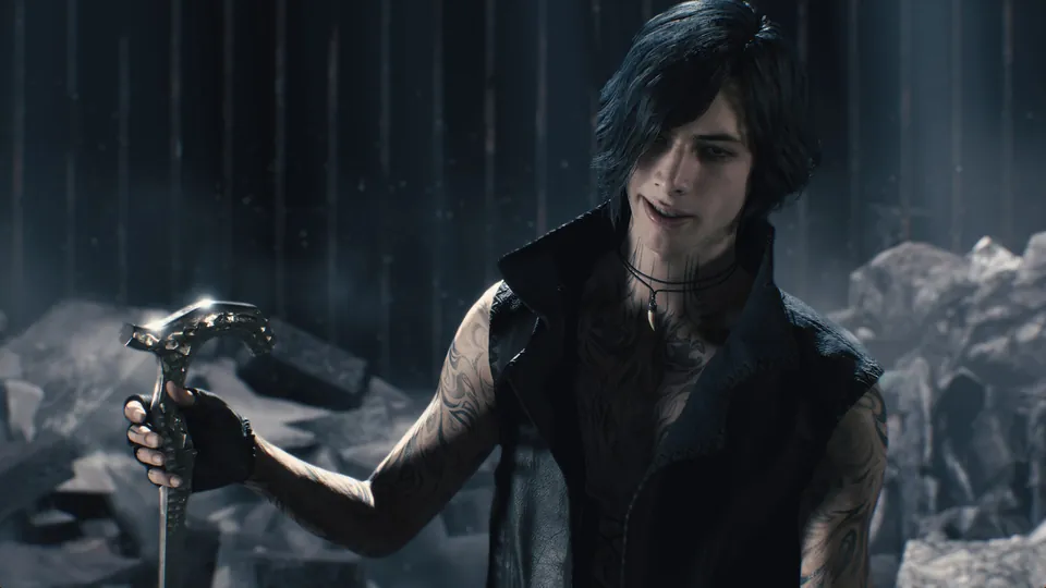 A dark-haired character with tattoos holds a silver cane among broken rubble in Devil May Cry 5